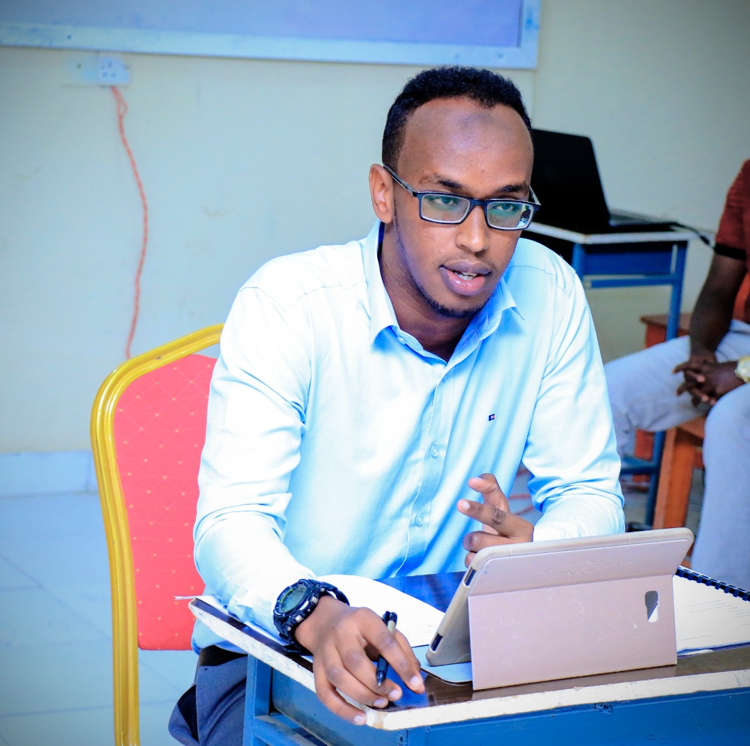 A student responding to questions from the panelists, at Amoud University School of Postgraduate Studies and Research (ASPGSR), during the Research Proposal Viva Voce conducted on Tuesday, January 28th, 2020 at Amoud University School of Postgraduate Studies and Research (ASPGSR), Borama Campus premises.