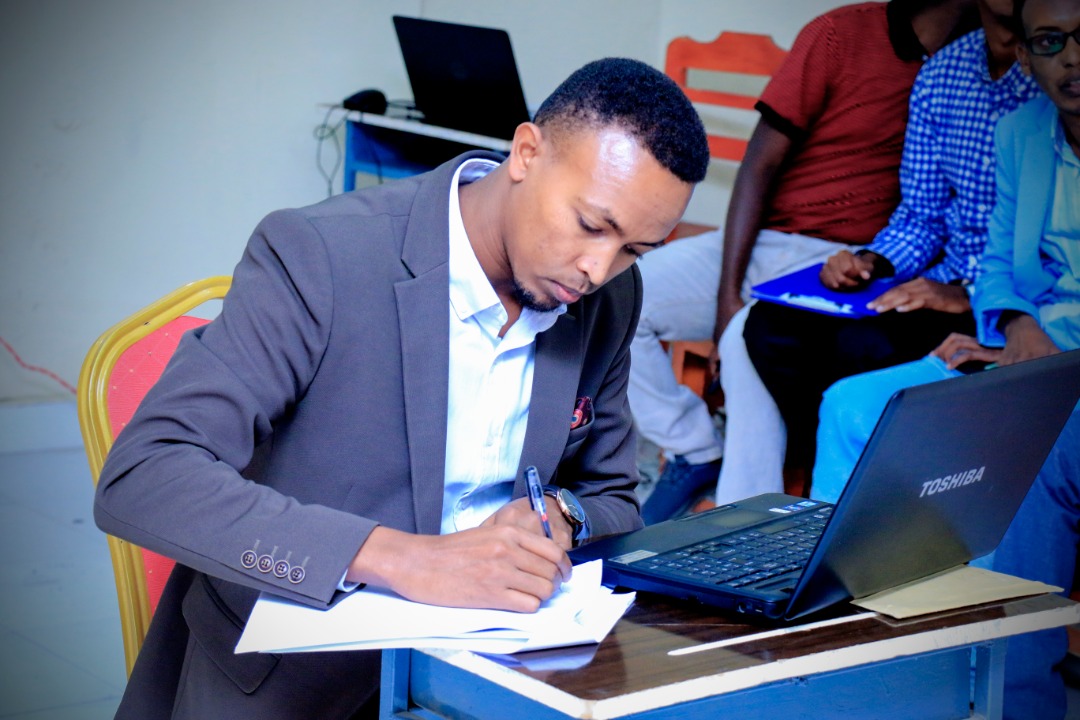 A student keenly listening to questions from the panelists and taking notes, at Amoud University School of Postgraduate Studies and Research (ASPGSR), during the Research Proposal Viva Voce conducted on Monday, January 27th, 2020 at Amoud University School of Postgraduate Studies and Research (ASPGSR), Borama Campus. A student keenly listening to questions from the panelists and taking notes, at Amoud University School of Postgraduate Studies and Research (ASPGSR), during the Research Proposal Viva Voce conducted on Monday, January 27th, 2020 at Amoud University School of Postgraduate Studies and Research (ASPGSR), Borama Campus.